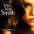 A split-screen image shows a woman with long brown hair and a dark top, with a stylized 'The Smiths' logo in the top-left corner.