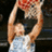A pixelated image of a person holding a basketball above their head, with a white background and black text reading "MVP" below.