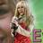 A pixelated static image shows a person with light hair wearing red and white clothing against a green background.