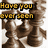 A pixelated chess-themed animation with changing text overlays over a sepia-toned background of chess pieces.