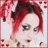 Pixelated static image of a person with red and dark brown hair styled in an updo, light skin tone, visible eye makeup, and pink accents on the background.