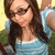 A woman with long brown hair and dark sunglasses wears a light blue striped top, captured in three sequential poses showing slight head movement.