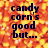 Pixelated text on a candy corn background with a gray rectangle overlay.