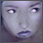 Static pixelated image of a woman's face with pale skin, dark eyes, and closed lips in neutral expression.