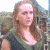 A pixelated image of a person with long brown hair wearing a dark sleeveless top, positioned next to green text reading 'Original Icons .com' on a solid background.