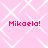 Pixelated pink background with white geometric patterns and four instances of red text reading "Mikaela!" in a