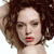 Pixelated close-up of a person with curly brown hair, closed eyes, and red lips against a white background.