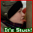 A pixelated side profile of a person in a dark beanie and purple scarf against a brown background, with green text reading "It's Stuck!" at the bottom.