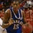Pixelated image of a person in sports attire with blue text labels on red background, including "ROCKCHALK JAYHAWK KU" and "Mario Chalmers GO KU".