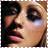 Pixelated close-up of a person's face with light skin tone, dark hair, and visible eye makeup including eyeliner and eyeshadow.