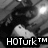 Black-and-white pixelated image of a person holding a white object with two small dots, overlaid with 'HOTurk™' text in the lower-left corner.