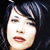 Static 50x50 pixel icon showing a close-up of a person's face with dark hair against a black background, rendered in low-resolution pixel art style.