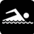 Pixelated white figure swimming left to right on black background with stylized water lines beneath.