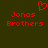 Red pixelated text 'Jonas Brothers' on dark green background with red heart symbol above left text.