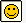 Pixelated yellow smiley face with black square eyes and a straight mouth, framed by layered borders on a light background.