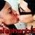 Two figures in close proximity with dark hair and light skin, one figure's hand near the other's face, red text overlay at bottom left.