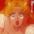 Pixelated anime-style character with orange hair and wide eyes, next to a broken red heart symbol and partial text 'Broken' on black background.