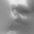 A grayscale pixelated image with indistinct shapes and varying shades of gray, lacking clear subjects or text.