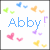 Pixelated icon with blue text 'Abby' surrounded by colorful heart shapes in green, blue, orange, pink, purple, and yellow.