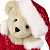 A pixelated contact sheet showing two frames of an animated icon featuring a teddy bear in Santa attire and green text on a dark background.