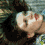 A pixelated image of a person with short dark hair lying down, showing three sequential facial expressions from left to right.