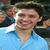 A person in a light blue collared shirt appears on the left side of a split composition, with pink text reading "Mrs. Ricky Ullman" on a black background to the right.