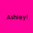 Four identical pixelated text displays on a solid pink background, each reading "Ashley!" in black font with visible digital artifacts.