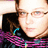 Pixelated close-up of a person with light skin wearing glasses and a dark top with pink and blue patterns, set against a light background.