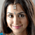 Static pixelated portrait of a person with long dark hair, light skin tone, and visible facial features including eyes, nose, mouth, and forehead mark.