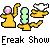 Pixel art image with three yellow figures and a green object on gray background, below text reading 'Freak Show' in blocky font.