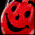 Red pixelated circular icon with black facial features: two eyes, a nose, and a wide smiling mouth.