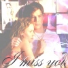 A static image shows two people embracing, with a woman resting her head on a man's shoulder, both wearing light-colored clothing, and text at the bottom.