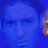 Static 48x48 pixel icon with dominant blue tones and partial visible orange/brown element on the right edge, appearing as a cropped or low-resolution image of a face or figure against a solid background.