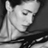 Black-and-white pixelated static icon showing a close-up of a person's face with closed eyes, visible ear, and neck in profile view against dark background.