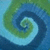 A pixelated spiral pattern with green and blue hues transitioning from outer edges to a light center.