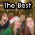 Four people pose together under text reading 'The Best' in white block letters on black rectangles, with one person wearing a Santa hat.