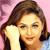 Static pixelated image of a person with brown hair against pink background, hand near face in contemplative pose.