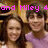 Two people with long dark hair pose closely together under pink pixelated text reading 'and Miley 4' against a blurred background.