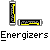 Static pixel art of 15 distinct icons on gray background, including battery-like items, green vibrators, and cartoon figures with text labels