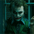 Pixelated image of a figure in dark clothing holding a light-colored object against a teal and dark green background with vertical lines.