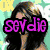 A pixelated image of a person with long dark hair and a light-colored top, overlaid with purple text reading "sevdie" on the left and cyan text reading "Rules" on the right.