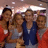 Group photo of five people on left, pink background with pixelated text on right.