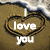A static pixelated icon with a brown textured background, featuring white text "I love you" inside a black heart outline.