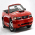 Red convertible car with black accents and silver wheels, viewed from a three-quarter front angle against a plain white background.