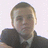 A static image with a red background, featuring a pixelated photo of a person in a dark jacket and tie, and text reading 'Chris Fergie is F*ck!!!'