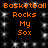 Black background with orange text reading "Basketball Rocks My Sox" repeated in two identical vertical , surrounded by white pixelated sparkles