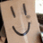 A pixelated image shows a light-skinned hand with dark lines forming a smiley face, next to brown background text reading STOP XXXXXX boxPHOBIA.