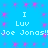Blue background with pink starburst patterns and repeated white text reading "I Luv Joe Jonas!!" in two