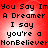 Red background with black pixelated text repeating 'You Say Im A Dreamer I say you're a NonBeliever' in four identical quadrants.