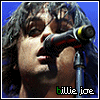 identical images showing a person with dark hair singing into a microphone, with text below each image